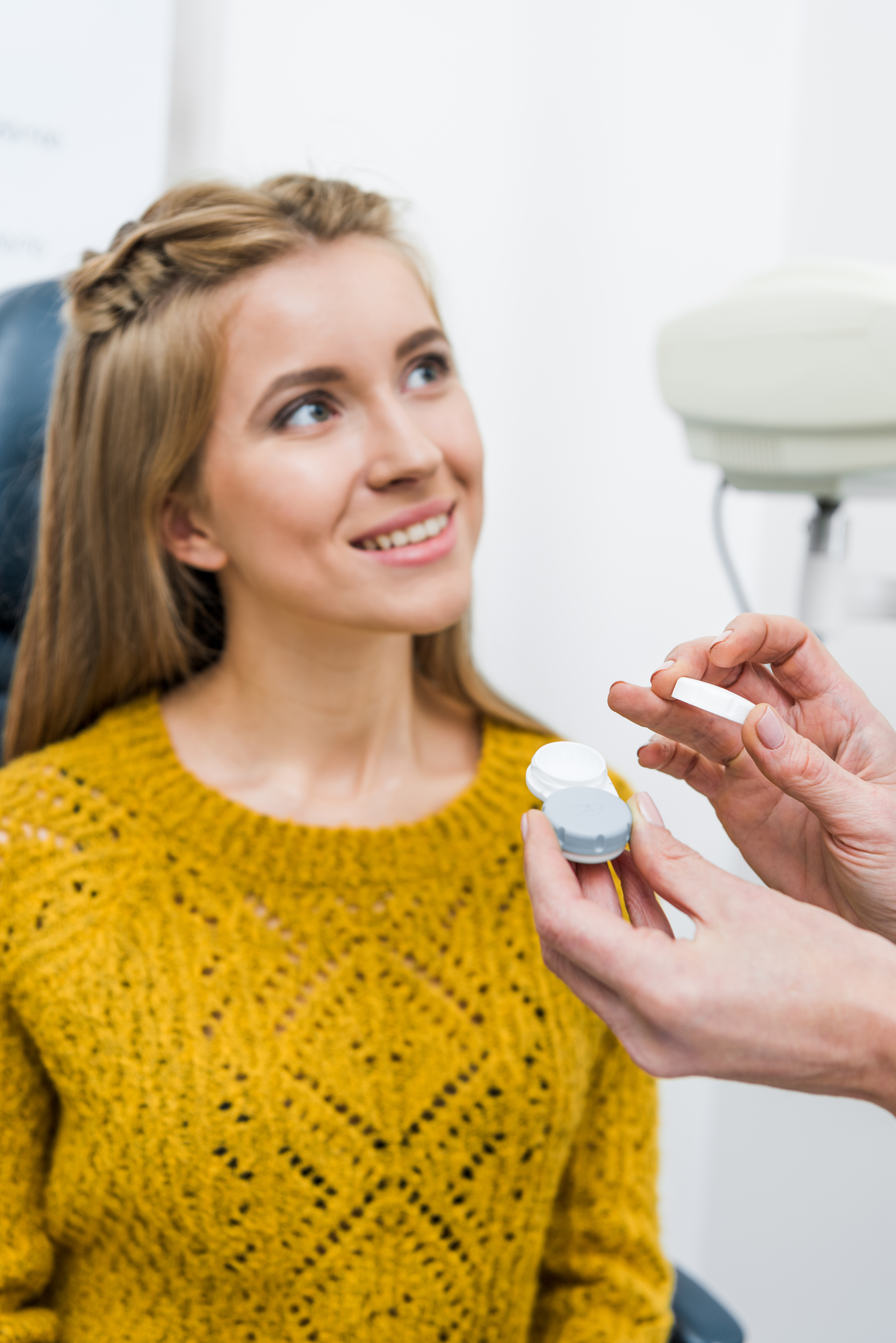 A wearer being fitted with Clearlii lenses at the optician
